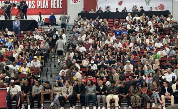 Dillon came to watch the Rockets  Summer League game today, sitting between Stone and Uduka